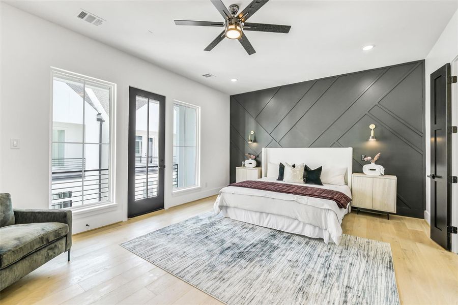 The primary suite showcases exceptional attention to detail—from the geometric accent wall and matte black doors to the precision-cut baseboards and solid-core interior doors that enhance sound privacy. The open layout offers seamless access to the spa-inspired bath and private balcony for quiet morning coffee or unwinding under the evening sky. The primary suite showcases exceptional attention to detail—from the geometric accent wall and matte black doors to the precision-cut baseboards and solid-core interior doors that enhance sound privacy. The open layout offers seamless access to the spa-inspired bath and private balcony for quiet morning coffee or unwinding under the evening sky.