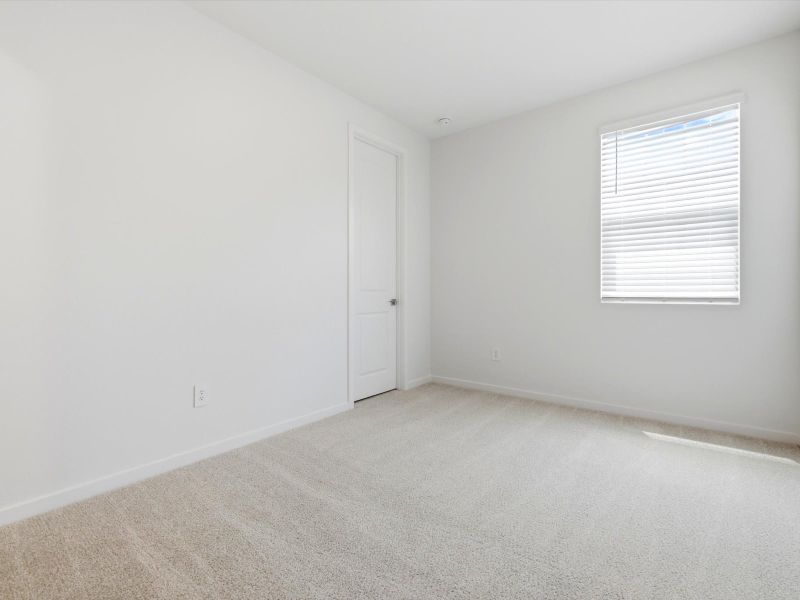 Spacious, unfurnished interior of a new home in Blossom Rock Reserve Series, Apache Junction (Image 19).
