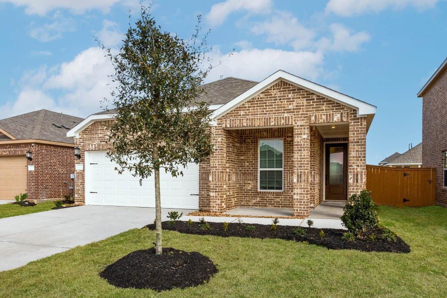 Front exterior of a new home in Emberly, Beasley, TX, highlighting curb appeal (Image 1).