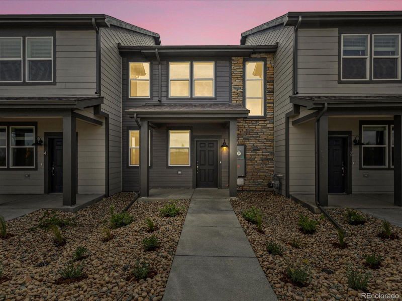 Front exterior of a new home in Poudre Heights: The Meadow Collection, Windsor, CO, highlighting curb appeal (Image 24).