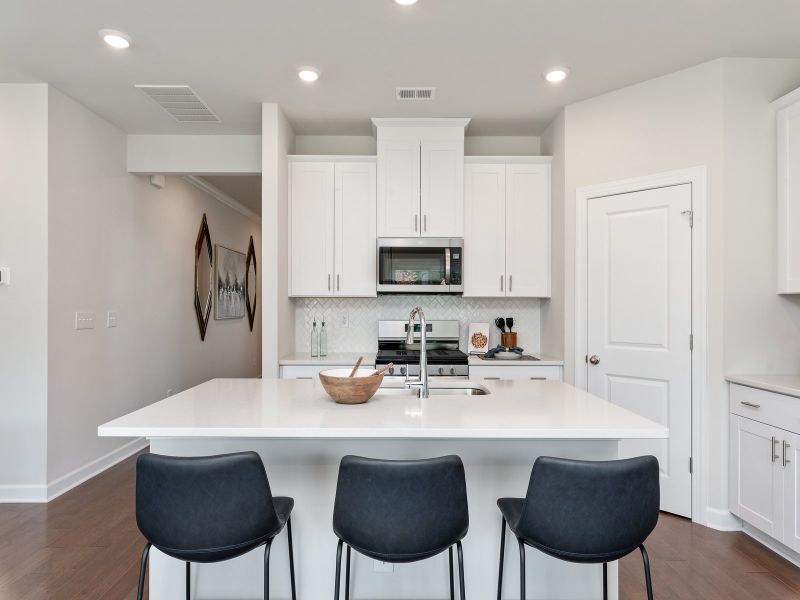 The well-appointed kitchen with a large island makes meal prep a breeze.