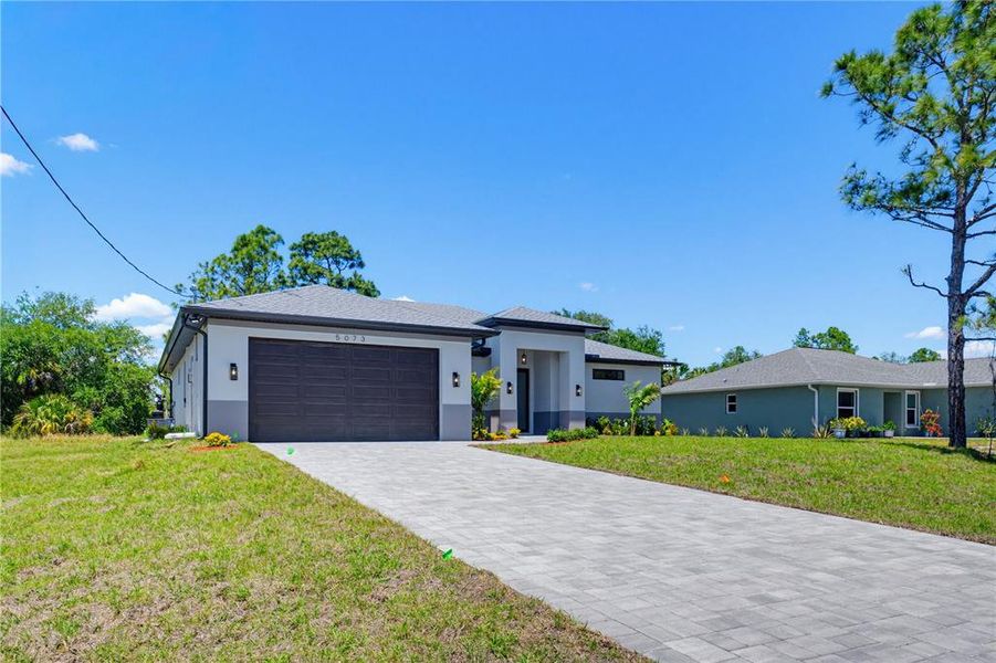 Front exterior of a new home in , North Port, FL, highlighting curb appeal (Image 26).