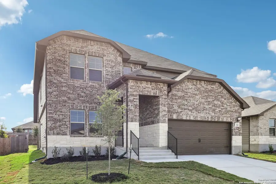 Front exterior of a new home in Legendary Trails - Classic Series, Cibolo, TX, highlighting curb appeal (Image 2). Front exterior of a new home in Legendary Trails - Classic Series, Cibolo, TX, highlighting curb appeal (Image 2).