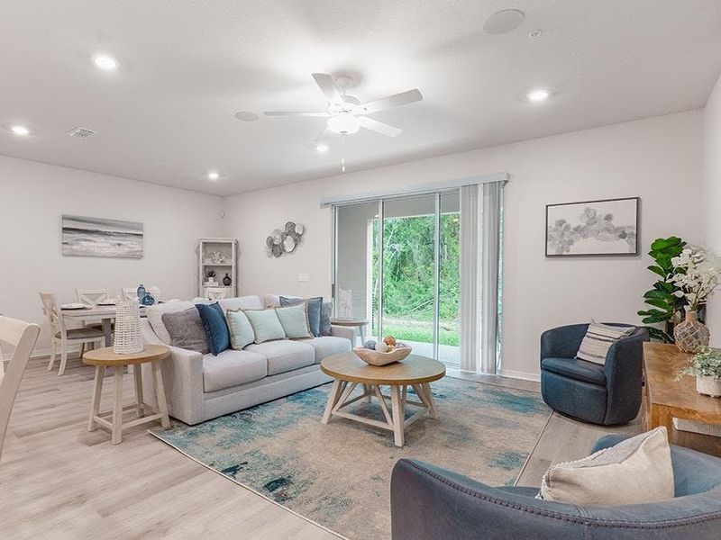Downstairs, enjoy a spacious, open living area - Aspen townhome by Highland Homes Downstairs, enjoy a spacious, open living area - Aspen townhome by Highland Homes