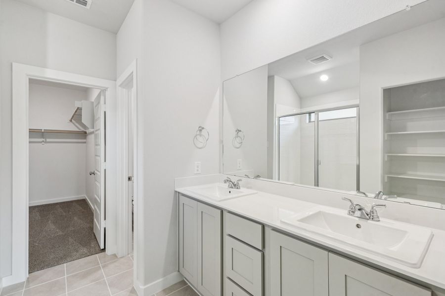 Primary Bathroom in the Oscar home plan by Trophy Signature Homes – REPRESENTATIVE PHOTO