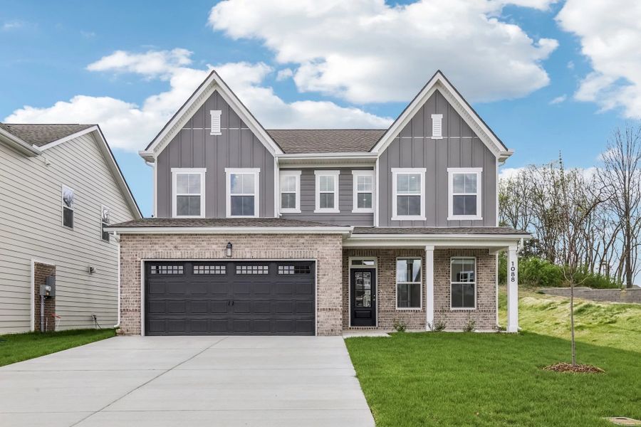 Front exterior of a new home in Ascent at Arbor Ridge, La Vergne, TN, highlighting curb appeal (Image 1). Front exterior of a new home in Ascent at Arbor Ridge, La Vergne, TN, highlighting curb appeal (Image 1).