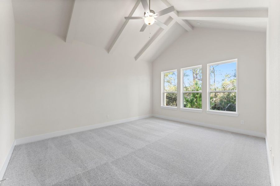 Vaulted Primary Bedroom with Beams & Woodland View