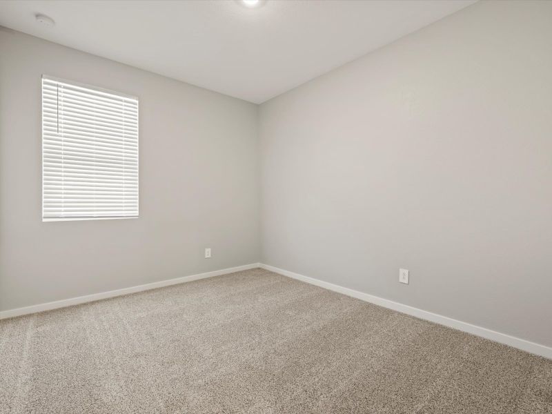 Spacious, unfurnished interior of a new home in Blossom Rock Reserve Series, Apache Junction (Image 16).