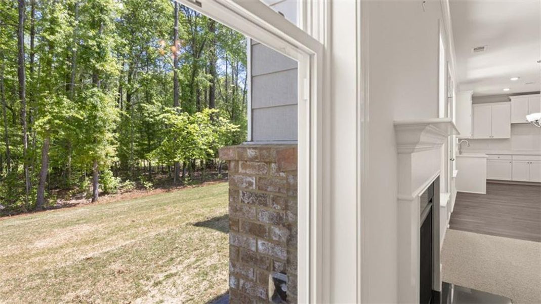Exterior details and patio area of a home in Evergreen Crossing, Locust Grove (Image 19).
