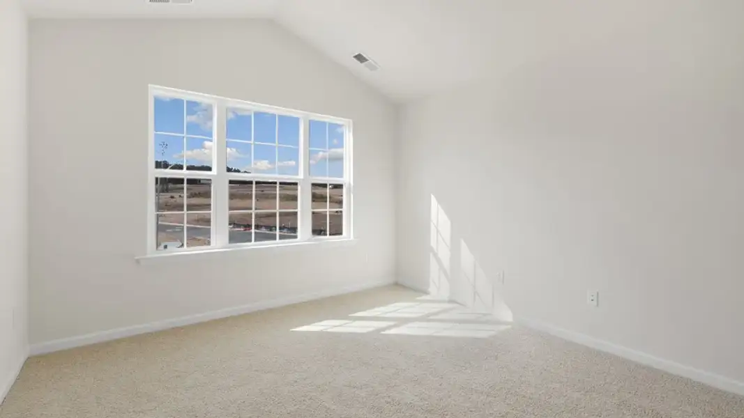 Spacious, unfurnished interior of a new home in The Townes at Galvins Ridge, Sanford (Image 26).