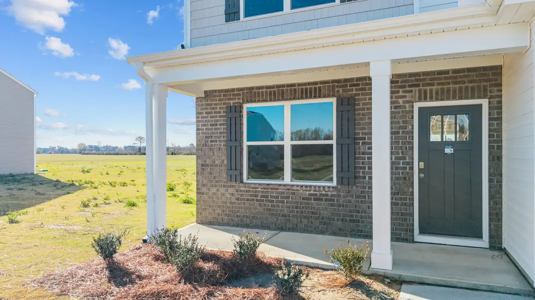 Exterior details and patio area of a home in Beaver Dam Crossing, Bailey (Image 3). Exterior details and patio area of a home in Beaver Dam Crossing, Bailey (Image 3).