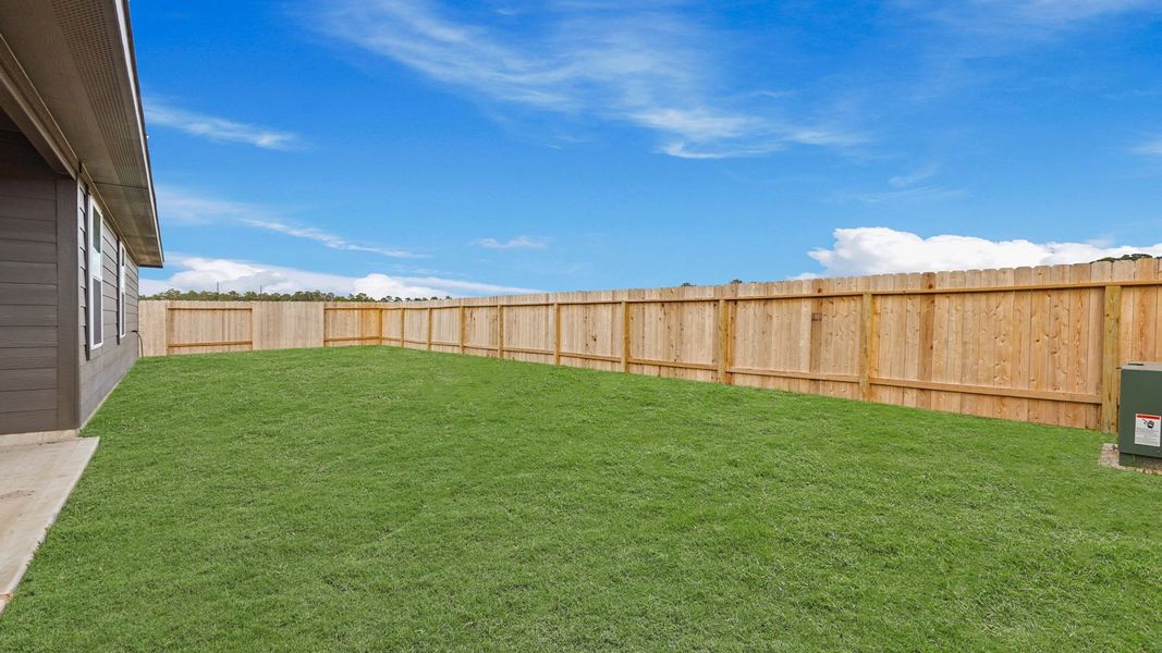Exterior details and patio area of a home in Grand Pines, Magnolia (Image 3).
