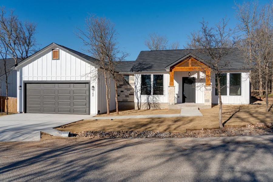 Front exterior of a new home in , Bastrop, TX, highlighting curb appeal (Image 20).