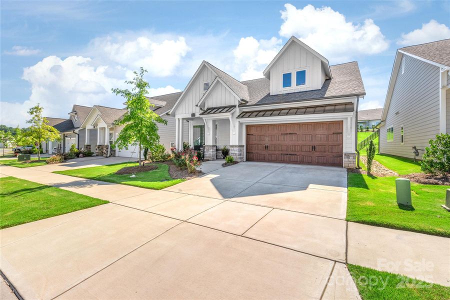 Front exterior of a new home in , Waxhaw, NC, highlighting curb appeal (Image 1).