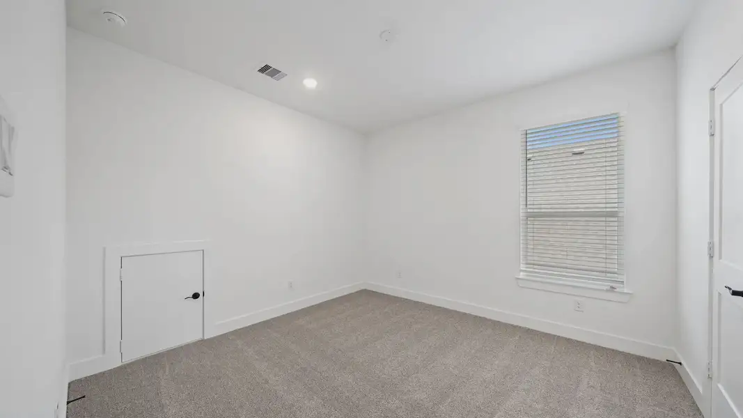 Representative unfurnished interior of a home built from the Waterloo by Chesmar Homes in Sofi Lakes, Katy (Image 38).