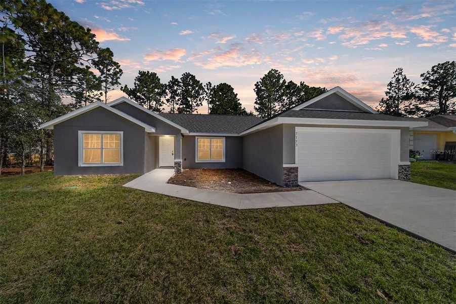 Front exterior of a new home in , Dunnellon, FL, highlighting curb appeal (Image 2).