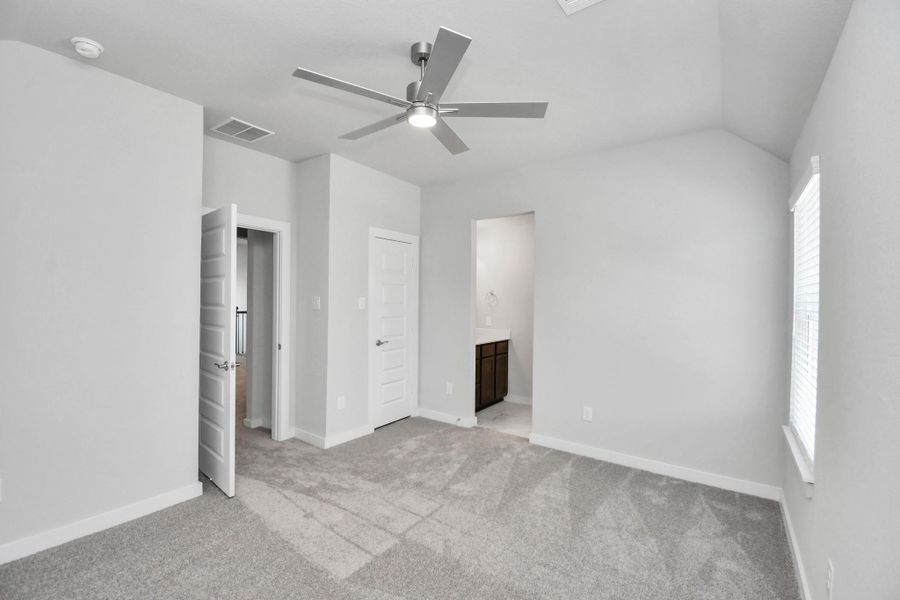 Generously sized secondary bedrooms featuring spacious closets, soft and inviting carpeting underfoot, large windows allowing plenty of natural light, and the added touch of privacy blinds for your personal retreat. Sample photo of completed home with similar floor plan. Actual colors and selections may vary.