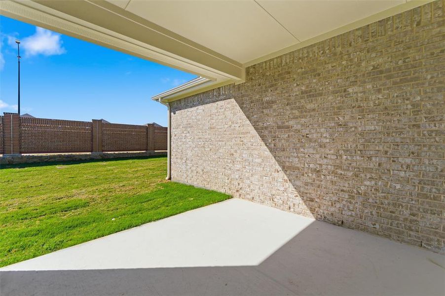 Fenced backyard featuring a patio area