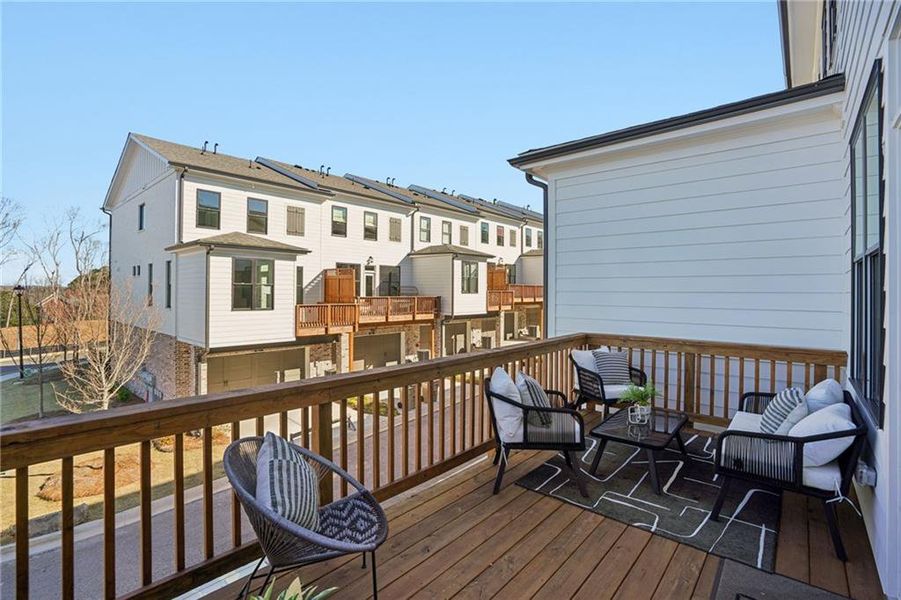 Exterior details and patio area of a home in Palisades Townhomes, Cumming (Image 3).