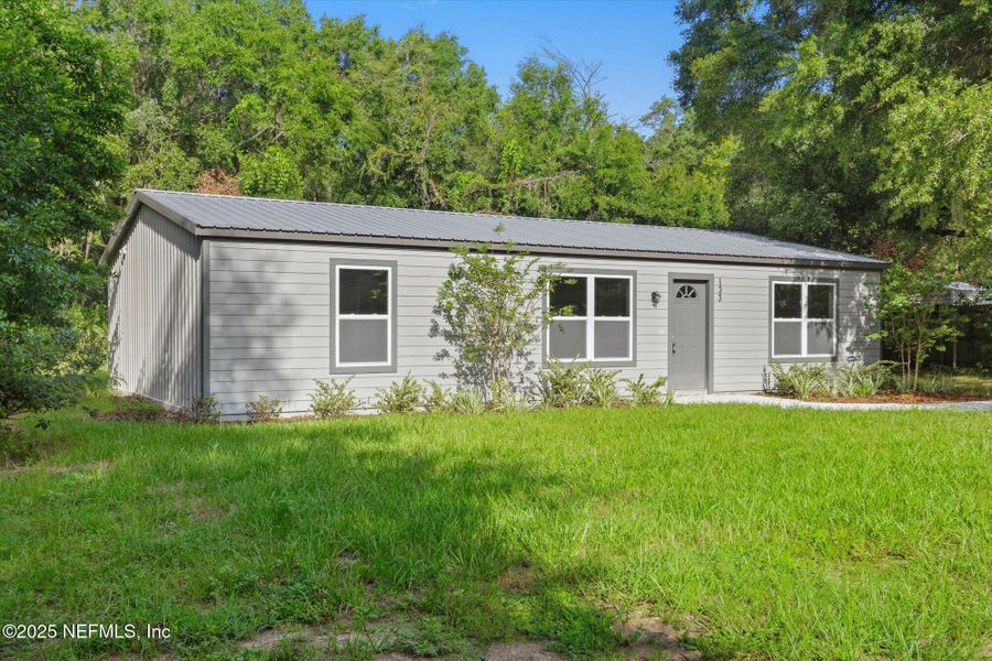 Front exterior of a new home in , Interlachen, FL, highlighting curb appeal (Image 21).