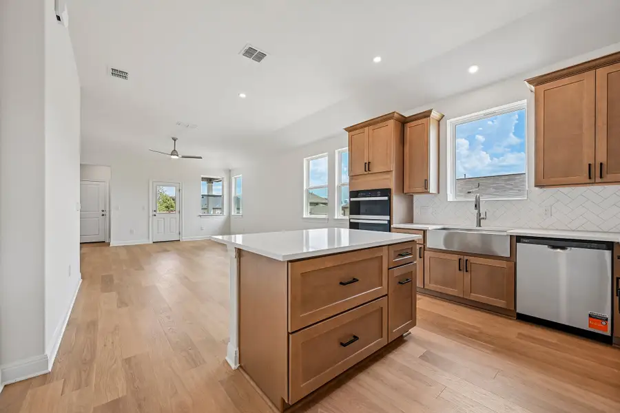 Furnished interior view inside a new home in Sage Hollow, Kyle (Image 6).