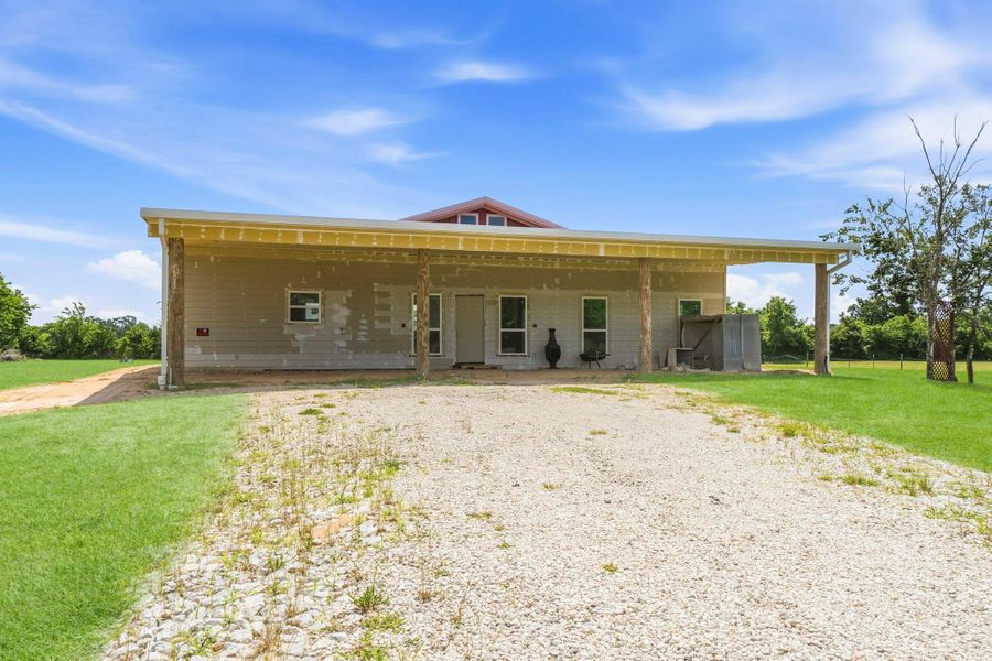 Additional storage building also located to the left of the home.