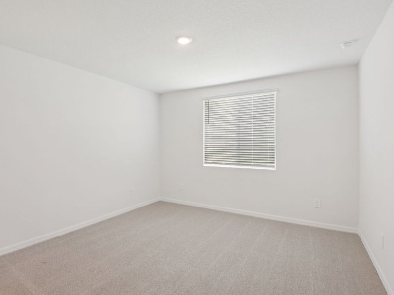 Spacious, unfurnished interior of a new home in The Grove at Stuart Crossing - Classic Series, Bartow (Image 10).