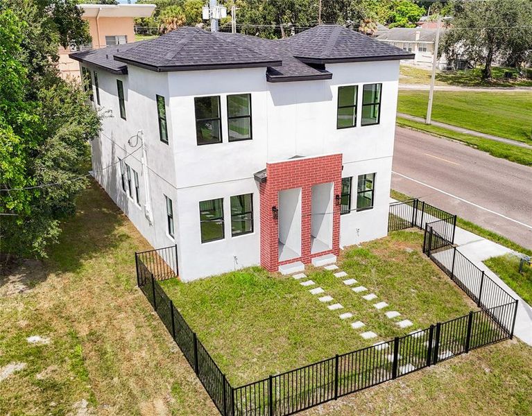 Front exterior of a new home in , Tampa, FL, highlighting curb appeal (Image 18).