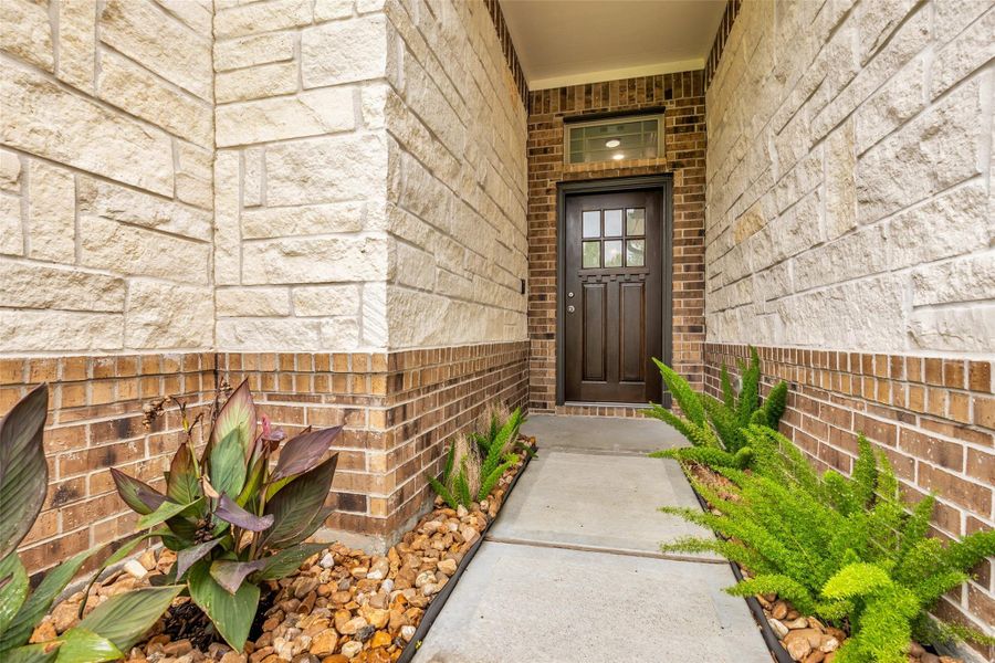 Beautiful lime stone & brick entrance, door was recently refinished.