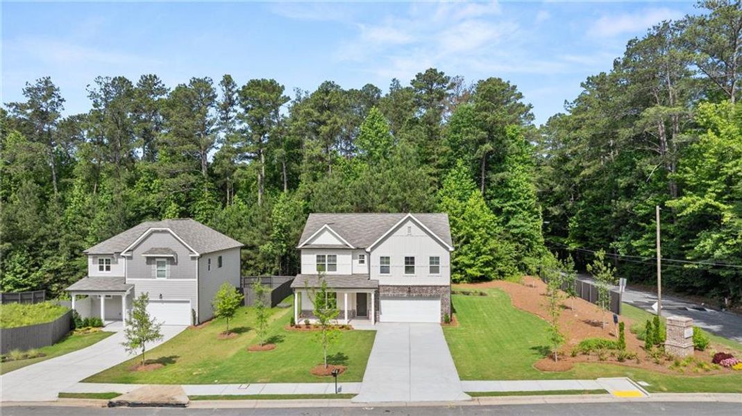 Front exterior of a new home in Whisper Creek, Atlanta, GA, highlighting curb appeal (Image 2). Front exterior of a new home in Whisper Creek, Atlanta, GA, highlighting curb appeal (Image 2).