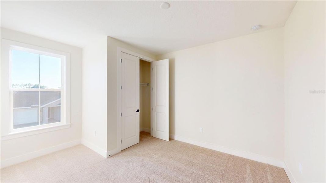 Spacious, unfurnished interior of a new home in Laureate Park, Orlando (Image 23).