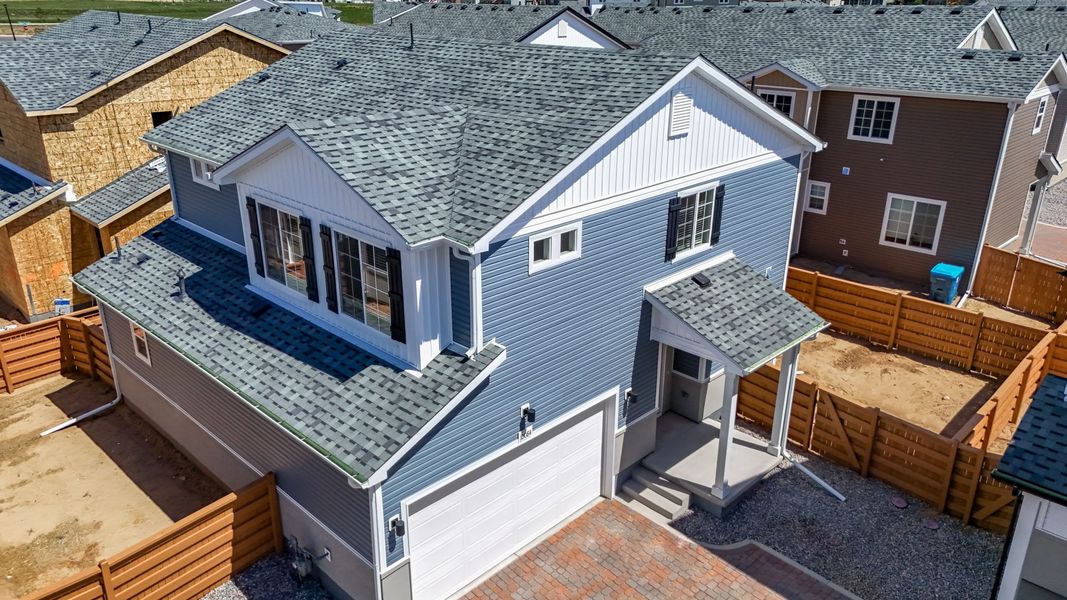 Exterior details and patio area of a home in Reunion, Commerce City (Image 22).
