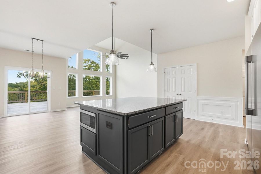 This culinary hub flows seamlessly into the Vaulted Great Room, creating the perfect space for daily living