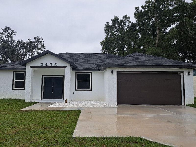 Front exterior of a new home in , Belleview, FL, highlighting curb appeal (Image 1). Front exterior of a new home in , Belleview, FL, highlighting curb appeal (Image 1).