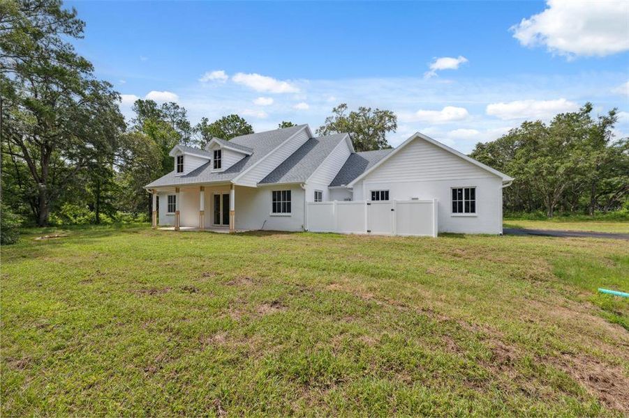 Exterior details and patio area of a home in , Brooksville (Image 29).