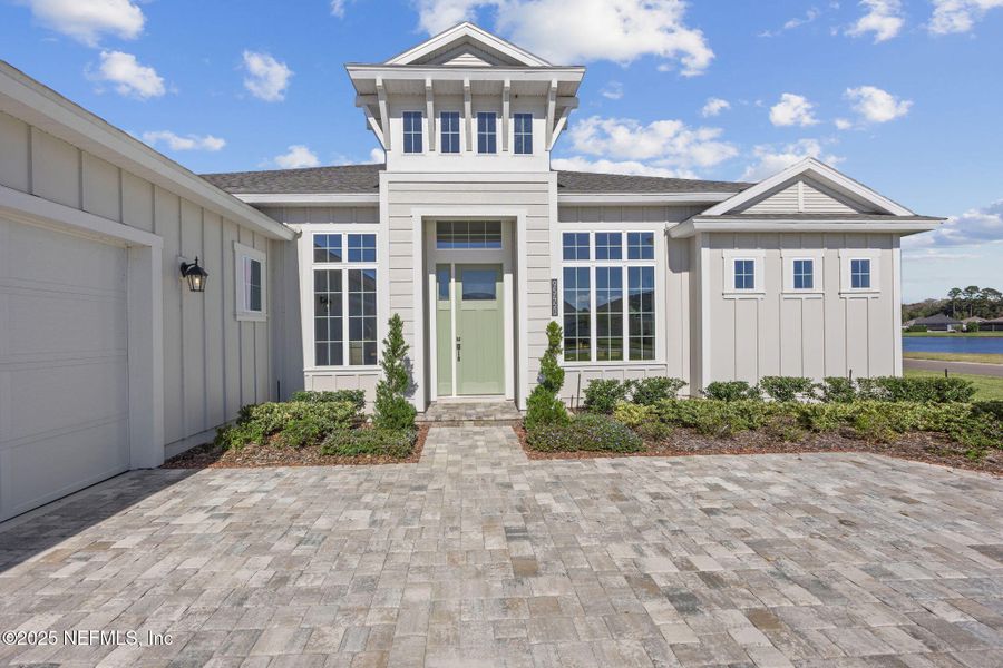 Front exterior of a new home in Amelia National, Fernandina Beach, FL, highlighting curb appeal (Image 1). Front exterior of a new home in Amelia National, Fernandina Beach, FL, highlighting curb appeal (Image 1).