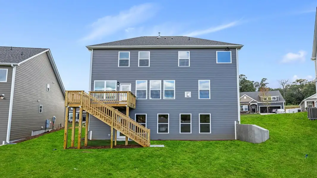 Exterior details and patio area of a home in Whitehawk Meadows, Travelers Rest (Image 3).