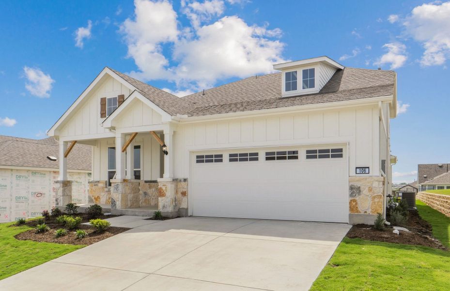 Front exterior of a new home in Sun City Texas, Georgetown, TX, highlighting curb appeal (Image 21).