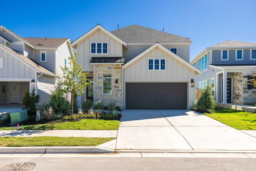 Front exterior of a new home in Easton Park 40', Austin, TX, highlighting curb appeal (Image 14). Front exterior of a new home in Easton Park 40', Austin, TX, highlighting curb appeal (Image 14).