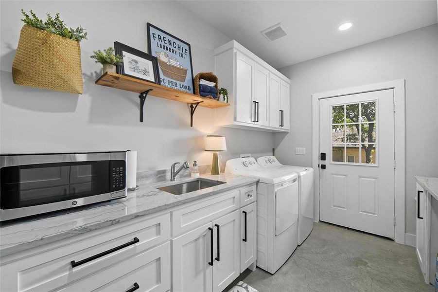 Laundry area featuring washer and clothes dryer, cabinet space, and recessed lighting Laundry area featuring washer and clothes dryer, cabinet space, and recessed lighting