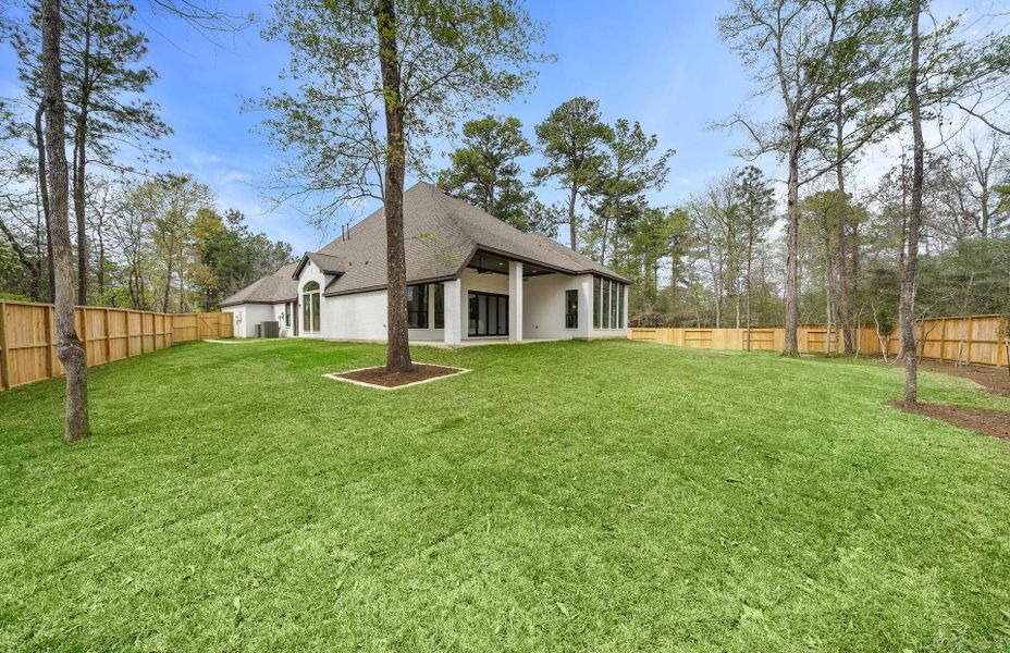 Exterior details and patio area of a home in The Woodlands Hills 65′, Willis (Image 3).