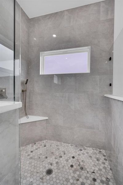 Bathroom featuring a tile shower