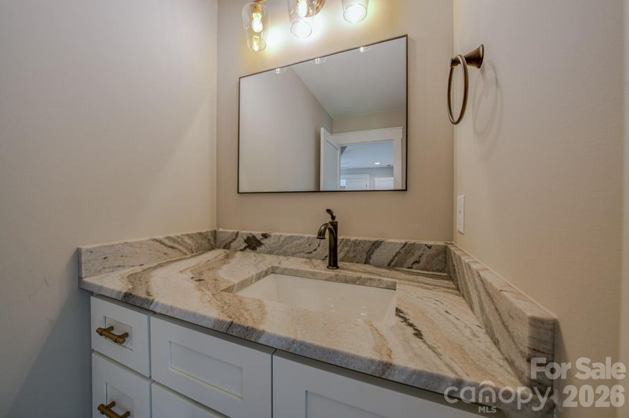 Jack and Jill upstairs bath 1 with individual & private sink.