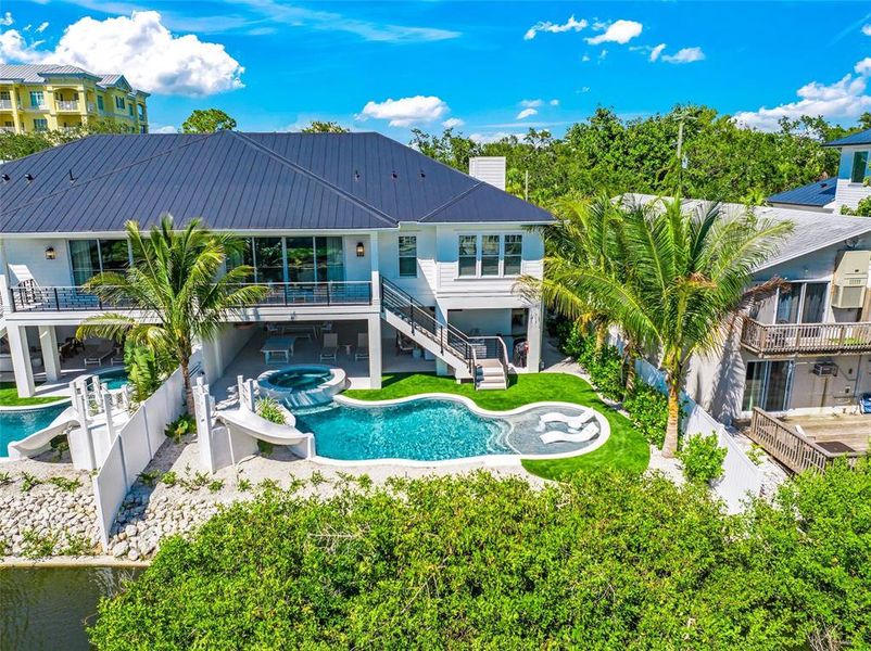 Front exterior of a new home in , Sarasota, FL, highlighting curb appeal (Image 36).