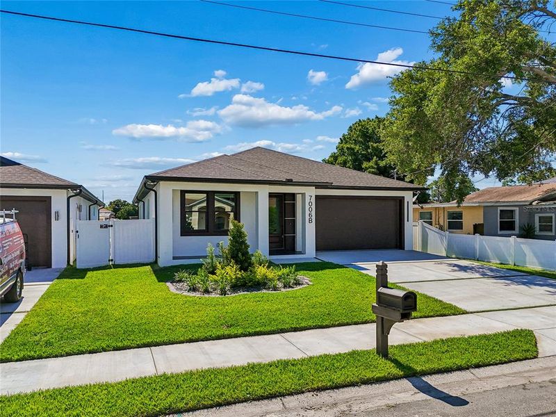 Front exterior of a new home in , Tampa, FL, highlighting curb appeal (Image 30).