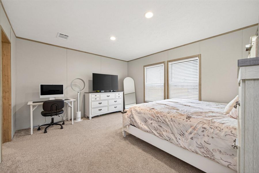 Spacious primary bedroom offering a comfortable layout with ample natural light Spacious primary bedroom offering a comfortable layout with ample natural light