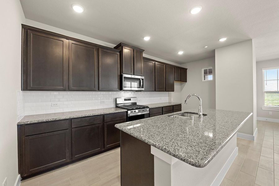 Every detail has been thoughtfully designed, from the state-of-the-art appliances that make meal prep a breeze, to the charming backsplash that adds a touch of personality. Every detail has been thoughtfully designed, from the state-of-the-art appliances that make meal prep a breeze, to the charming backsplash that adds a touch of personality.