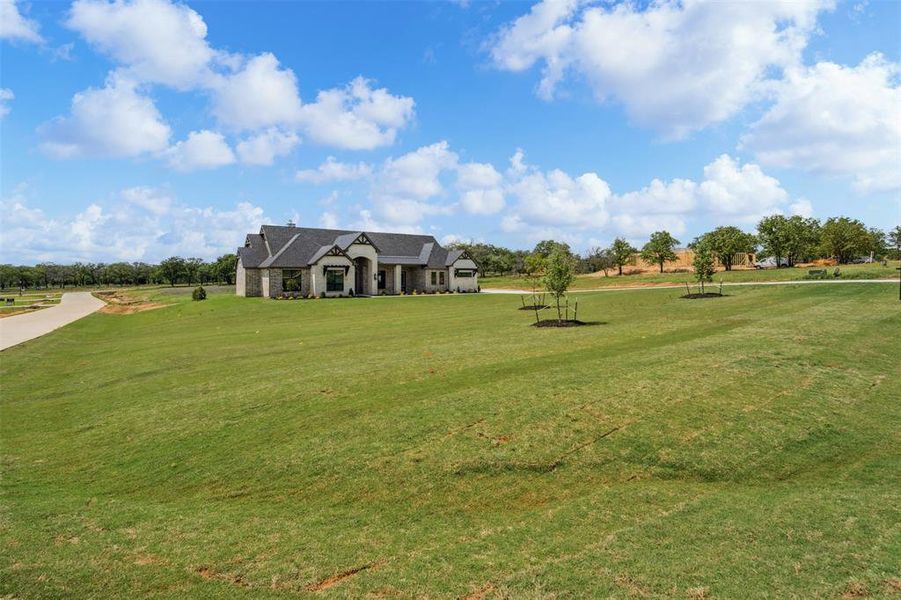 Front exterior of a new home in , Weatherford, TX, highlighting curb appeal (Image 23). Front exterior of a new home in , Weatherford, TX, highlighting curb appeal (Image 23).
