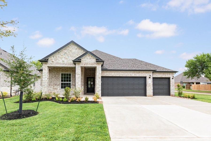 Front exterior of a new home in Lake Conroe Area Homes, Montgomery, TX, highlighting curb appeal (Image 16). Front exterior of a new home in Lake Conroe Area Homes, Montgomery, TX, highlighting curb appeal (Image 16).