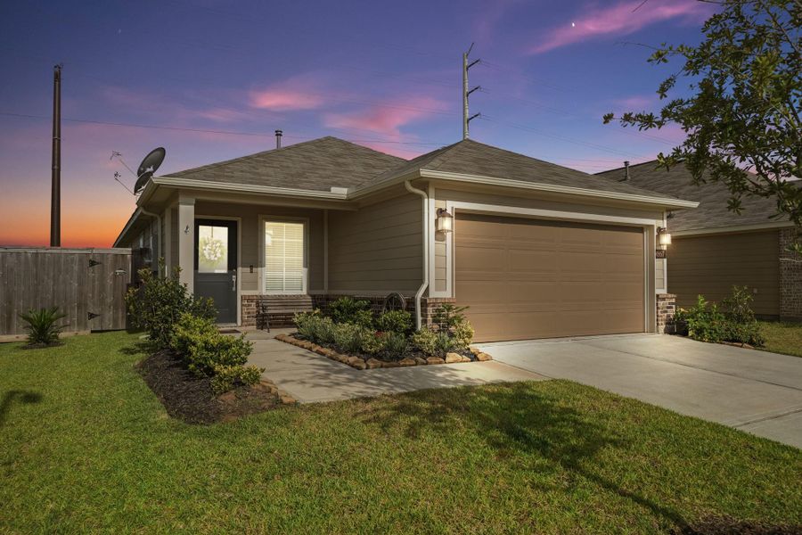 Front exterior of a new home in Ambrose, La Marque, TX, highlighting curb appeal (Image 21). Front exterior of a new home in Ambrose, La Marque, TX, highlighting curb appeal (Image 21).